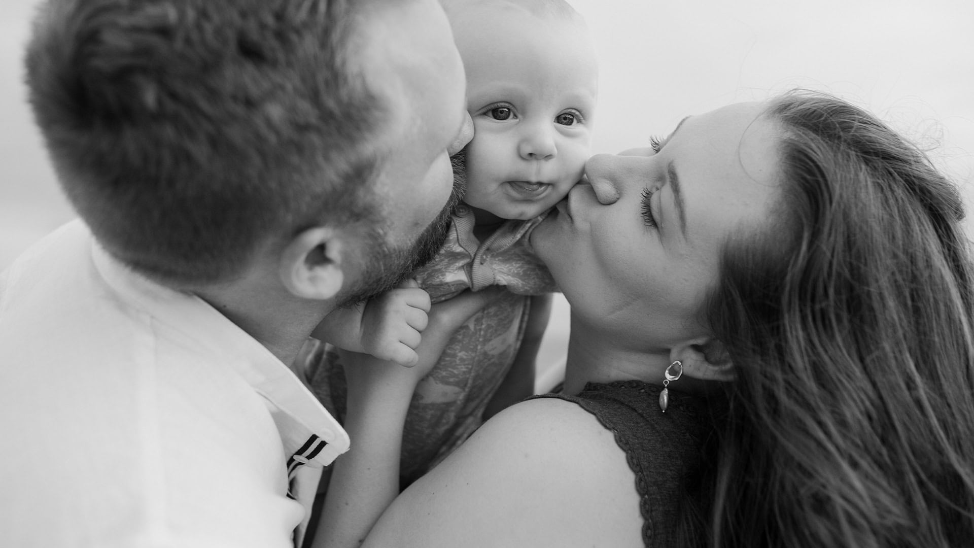 family-kisses-closeup