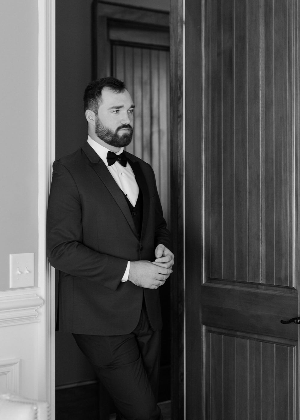 stoic-groom-in-doorway
